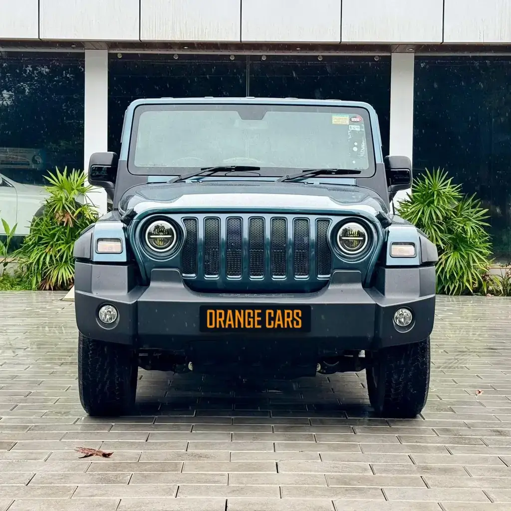 Front view of a rugged Mahindra Thar SUV, popular for stylish groom entries and rentals in Kollam.